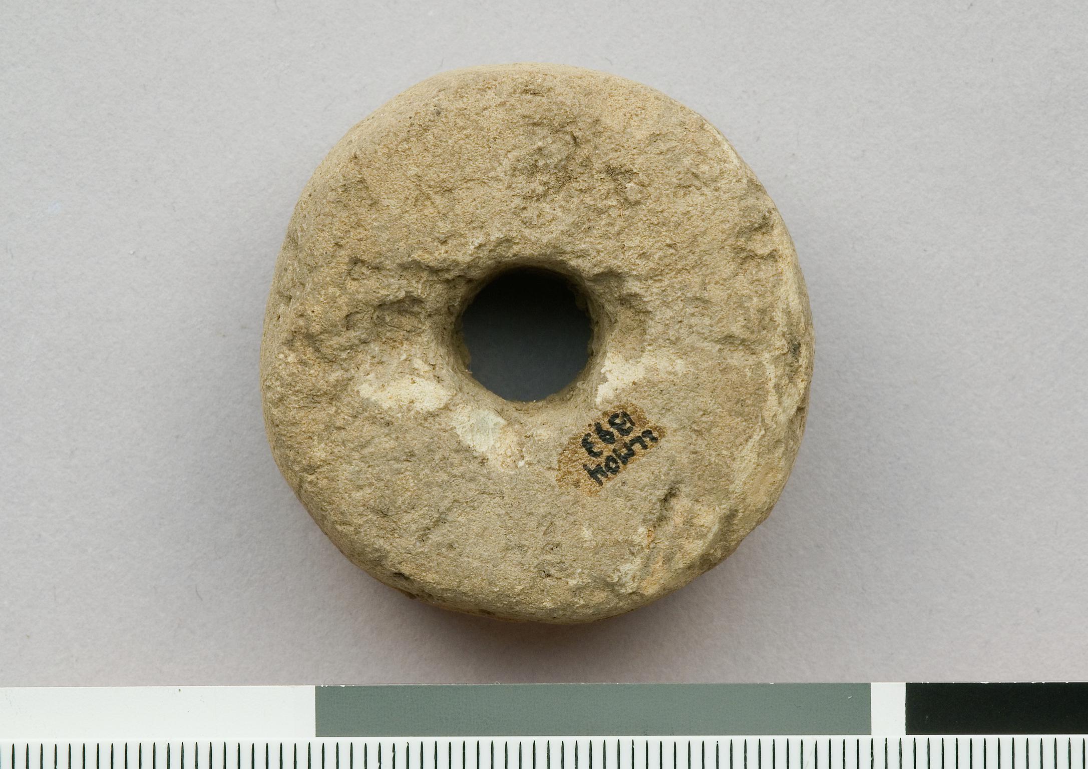 Prehistoric ceramic spindle whorl