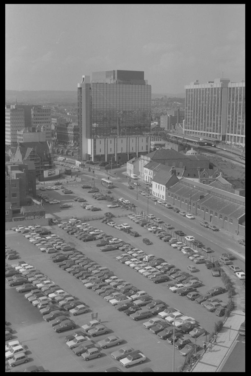 View to north east Butetown from building in Bute Terrace, with Helmont House (Churchill Way) and Brunell House in background, and car parks in foreground.