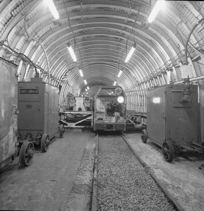 Black and white film negative showing an electric locomotive underground at Oakdale Colliery, May 1980.  &#039;Oakdale May 1980&#039; is transcribed from original negative bag.