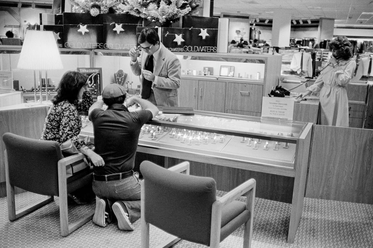 USA. ARIZONA. Phoenix. Wedding ring choice at the largest department store in Arizona, Goldwaters. 1979.