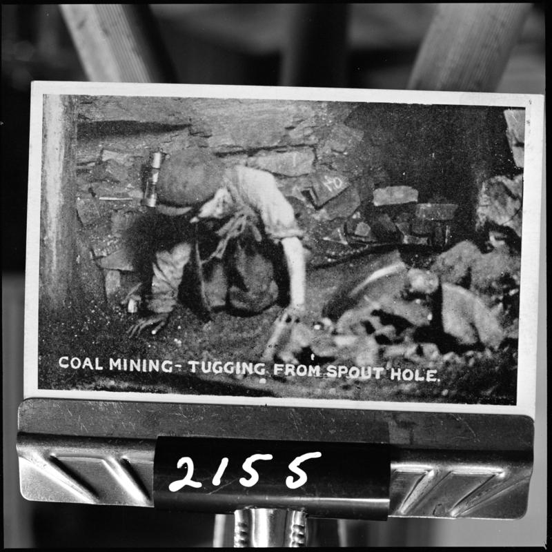 Black and white film negative of a photograph showing the &#039;tugging from spout hole&#039; (information taken from the caption on the photograph), unidentified colliery.  &#039;Tugging&#039; is transcribed from original negative bag.