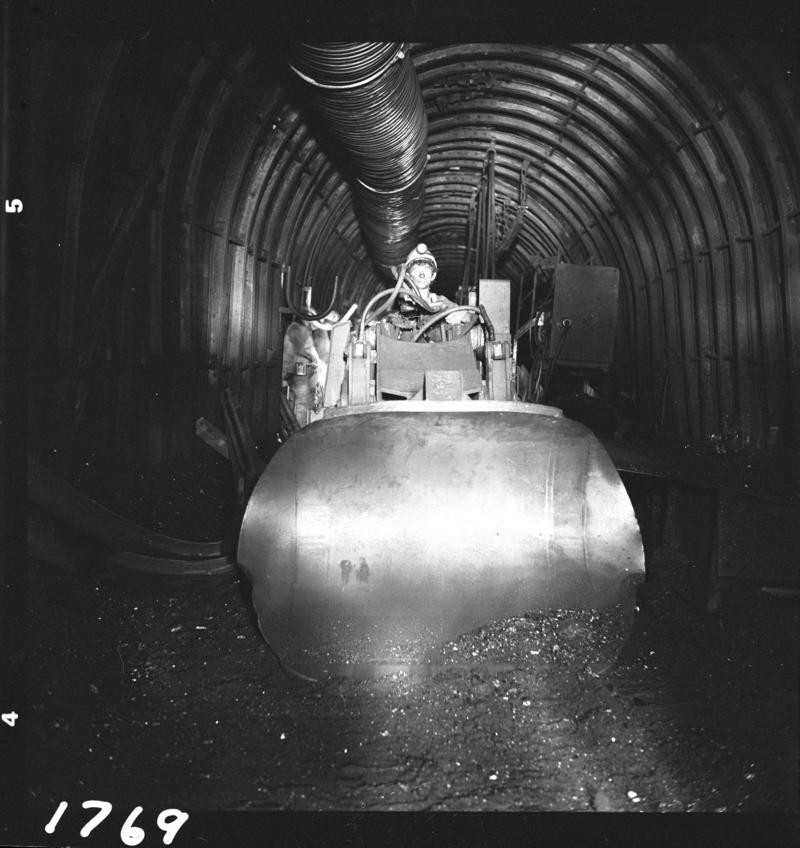 Black and white film negative showing a man operating an Eimco machine,  Blaengwrach Mine, 1 November 1979.