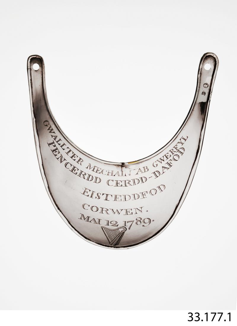 A silver plated brass gorget