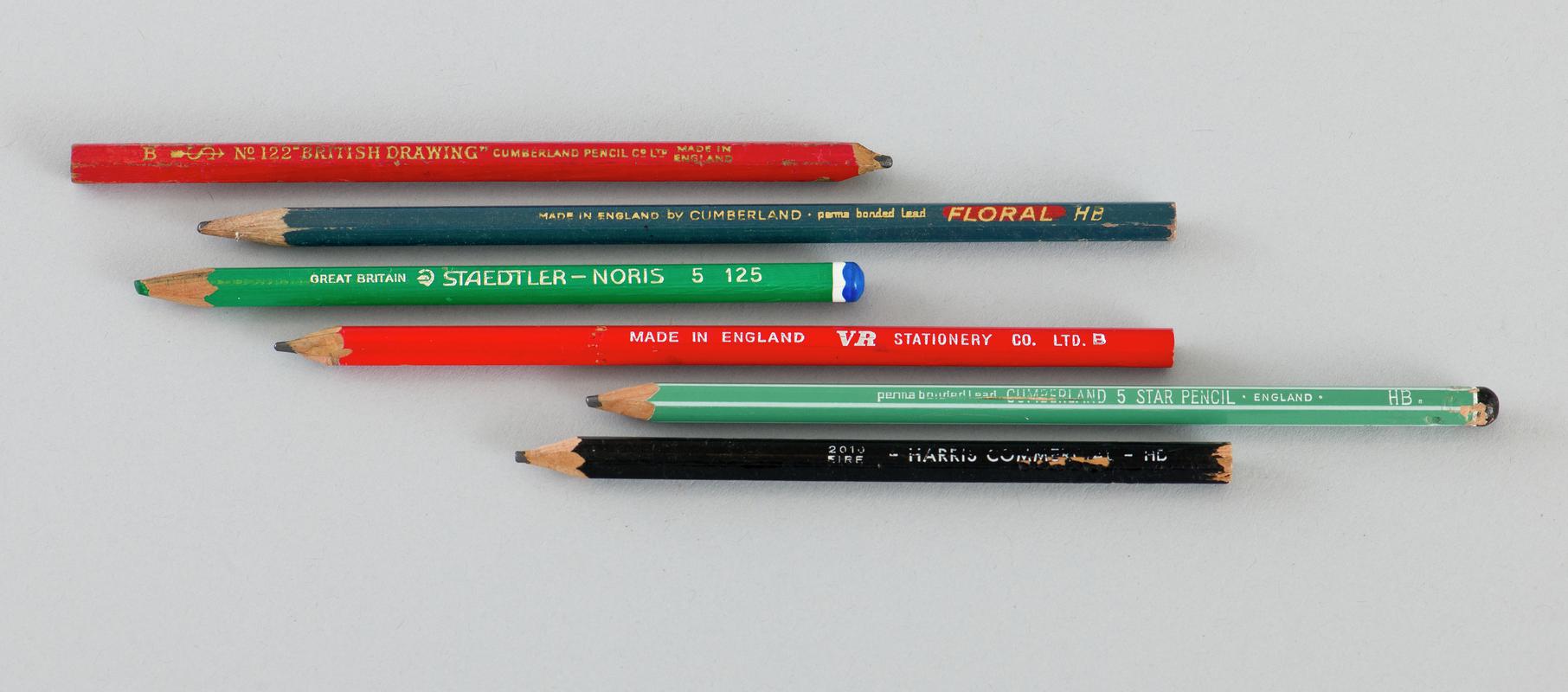 Six pencils (two green, two red, one blue and one black).