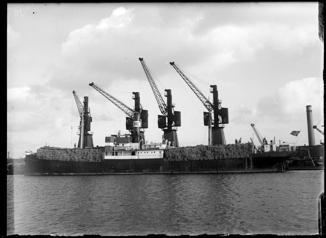 Port broadside view of S.S. ELNA E. at Cardiff Docks, c.1936.