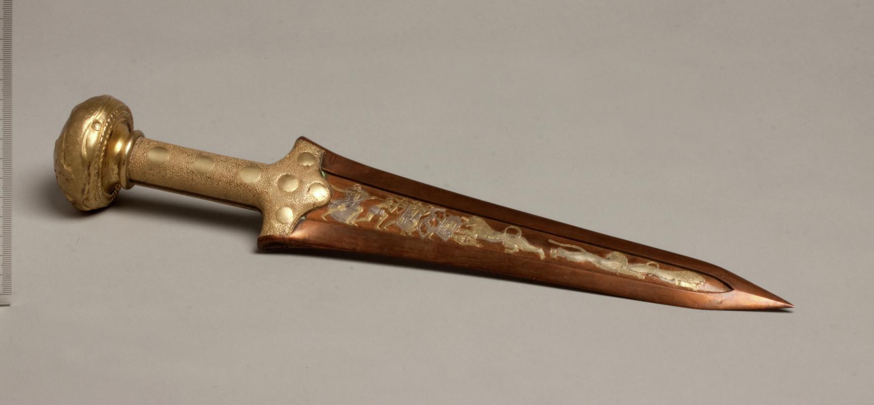 Replica Bronze Age dagger depicting a lion hunting scene