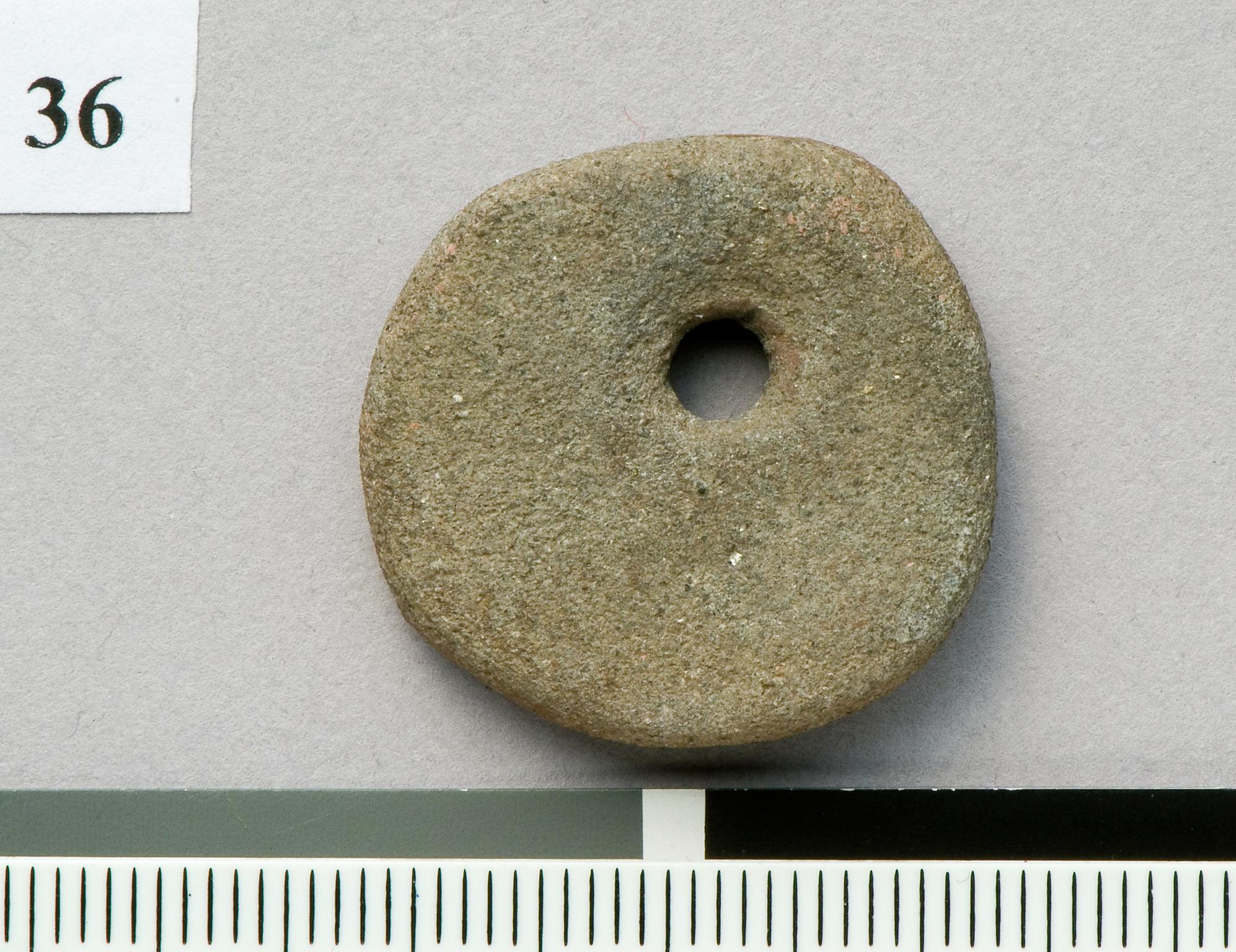 Neolithic stone disc pendant