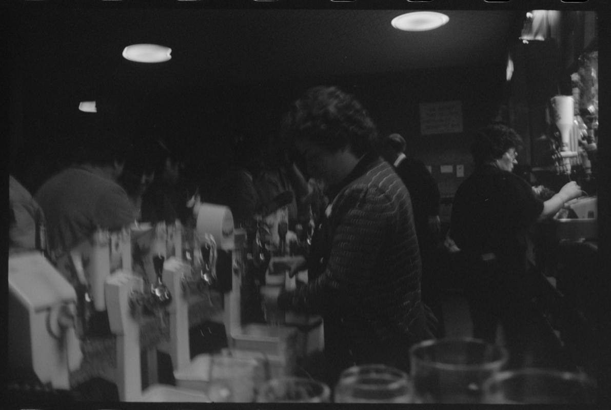 Staff behind bar at the Dowlais, Butetown.