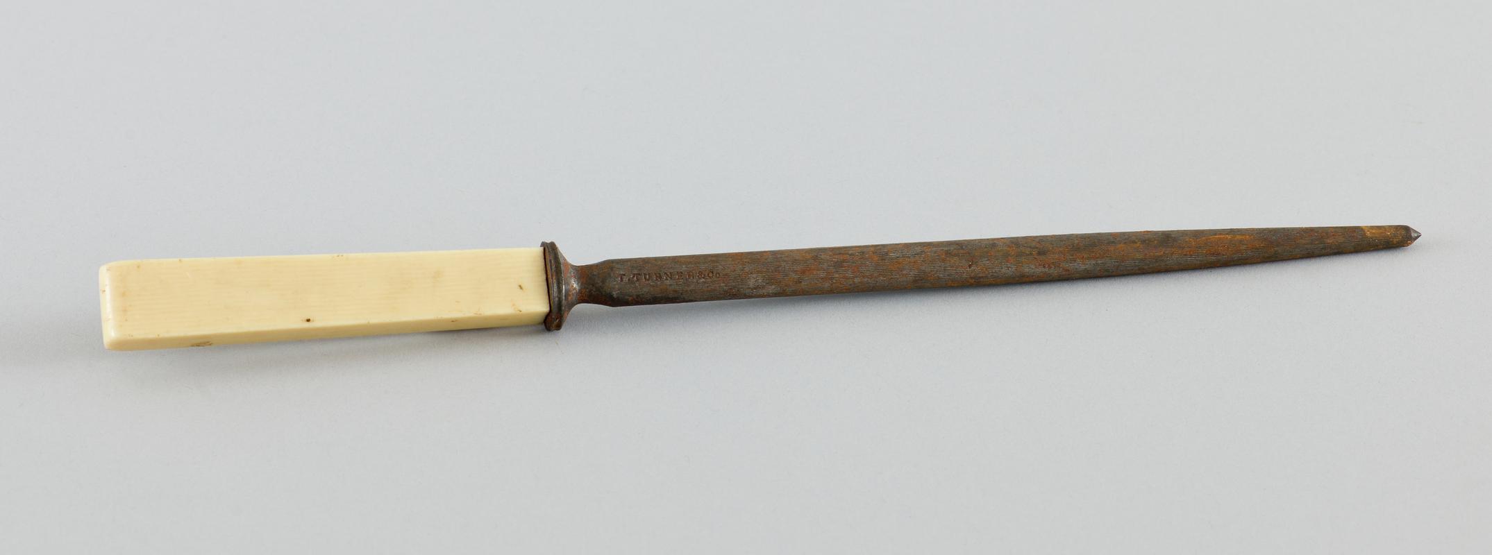 Knife steel/sharpener (rusting) with imitiation bone handle.