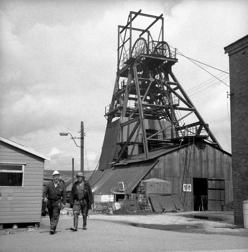 2 officials walking across the yard, Big Pit
