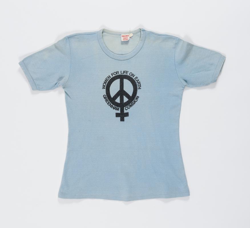 Blue &#039;Women For Life on Earth Greenham Common&#039; t-shirt worn by Thalia Campbell
