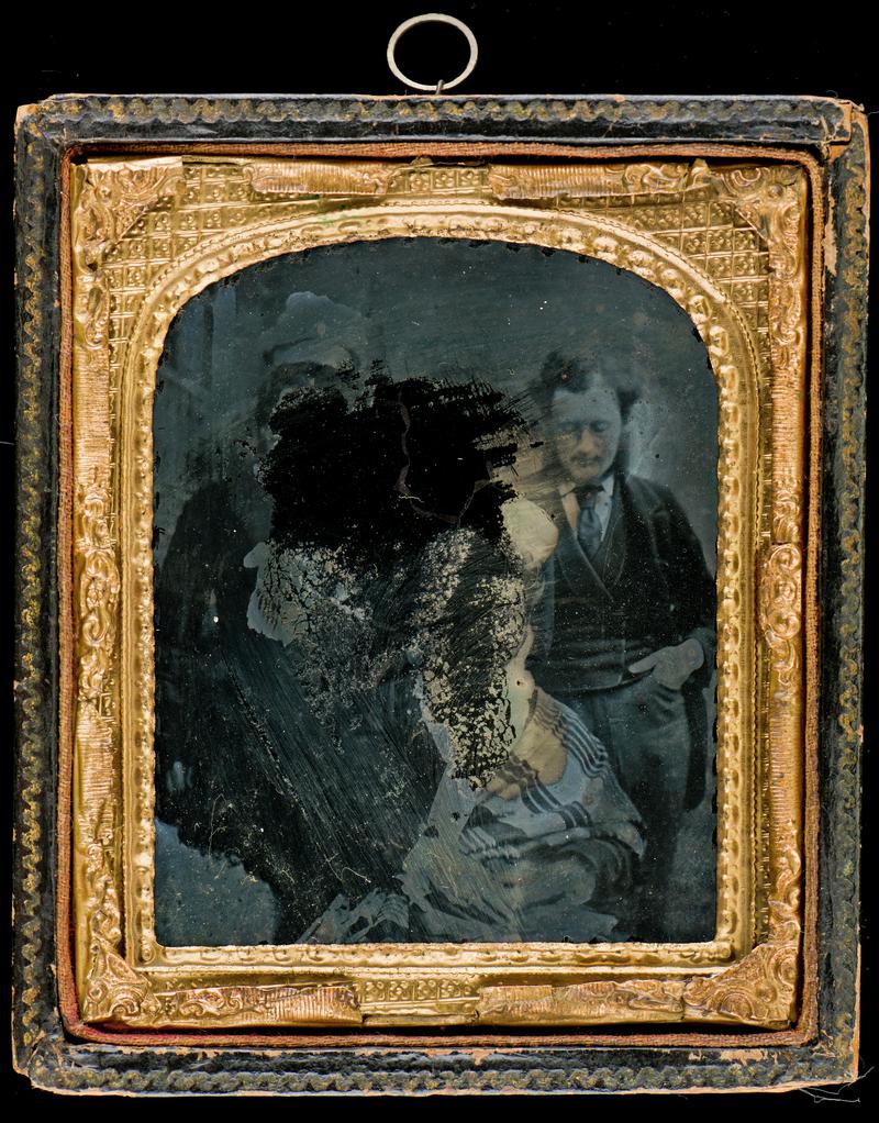 Portrait of two women and a man