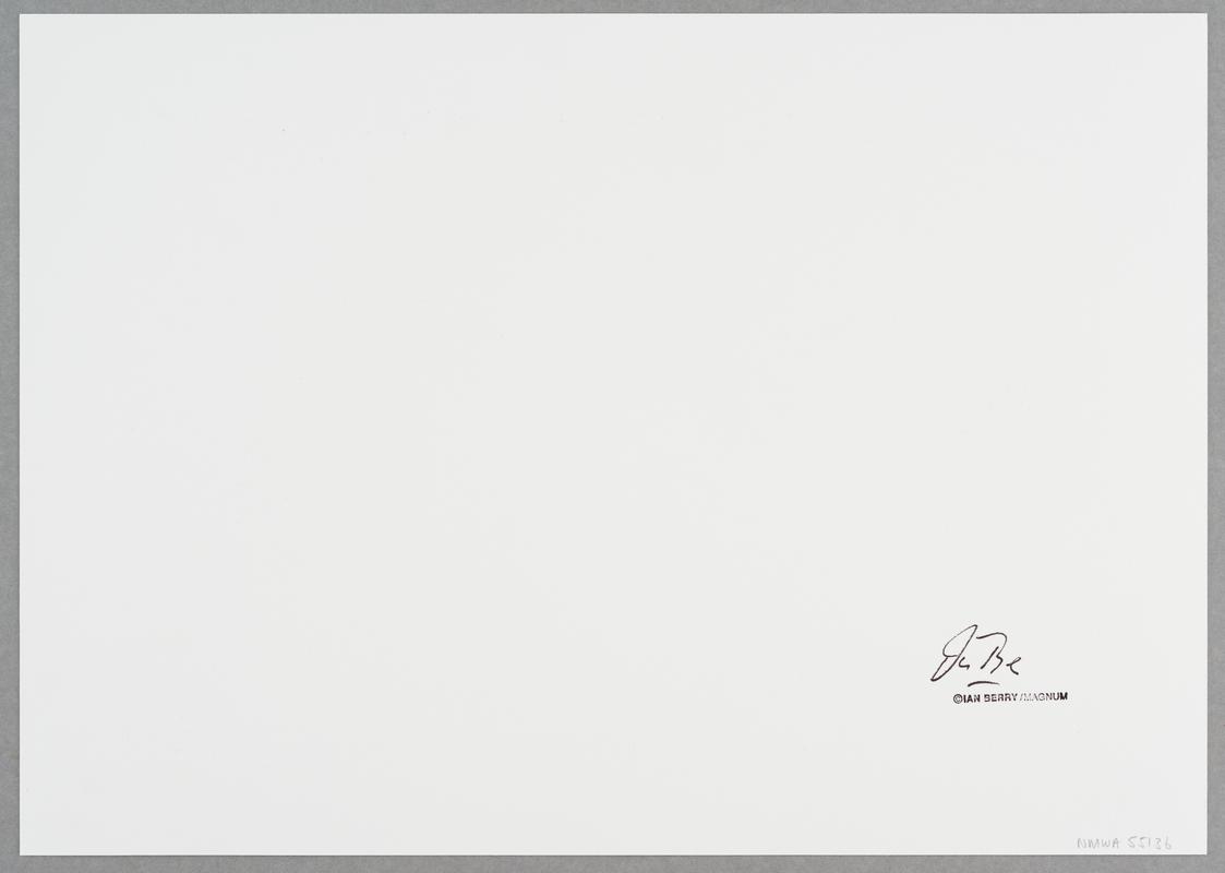 An elderly white patient wakes up in a hospital to find two black male nurses tending him. Midlands, England