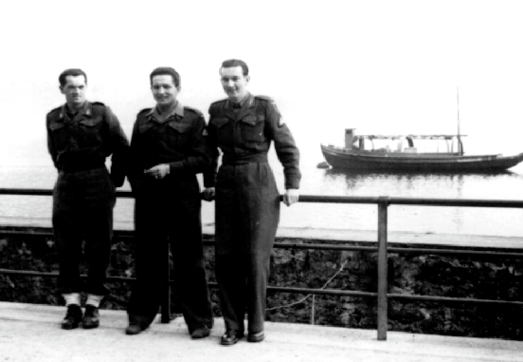 3 soldiers at an Italian riverside
