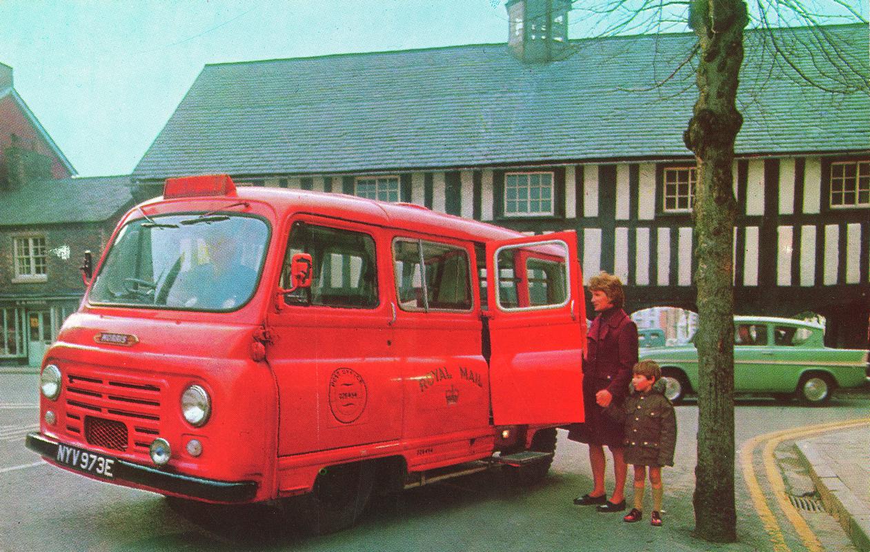 Postal mini-bus infront of Llanidloes market building.