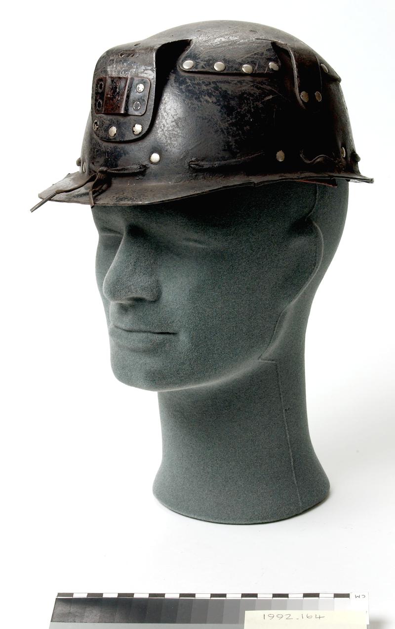 Helmet, black compressed cardboard.