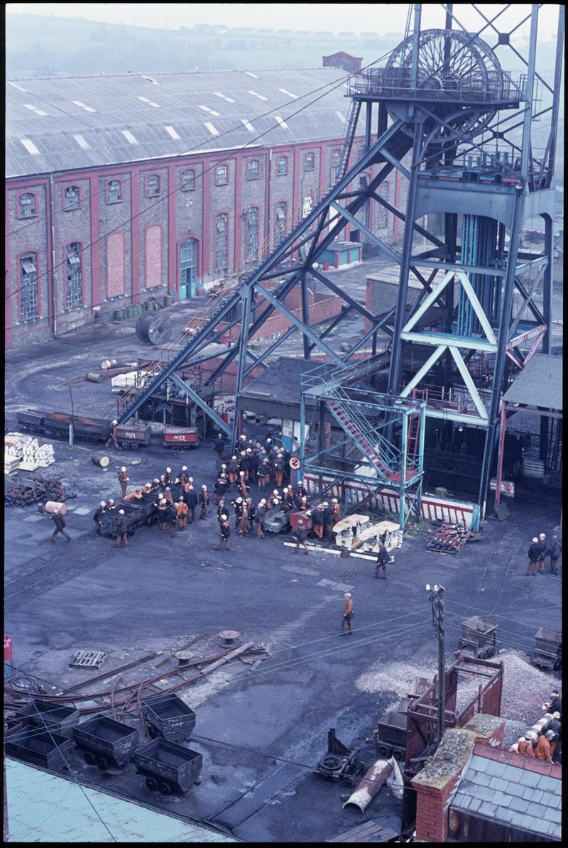 Colour film slide showing a general view of Penallta Colliery from the baths, with the afternoon shift waiting to descend, April 1981