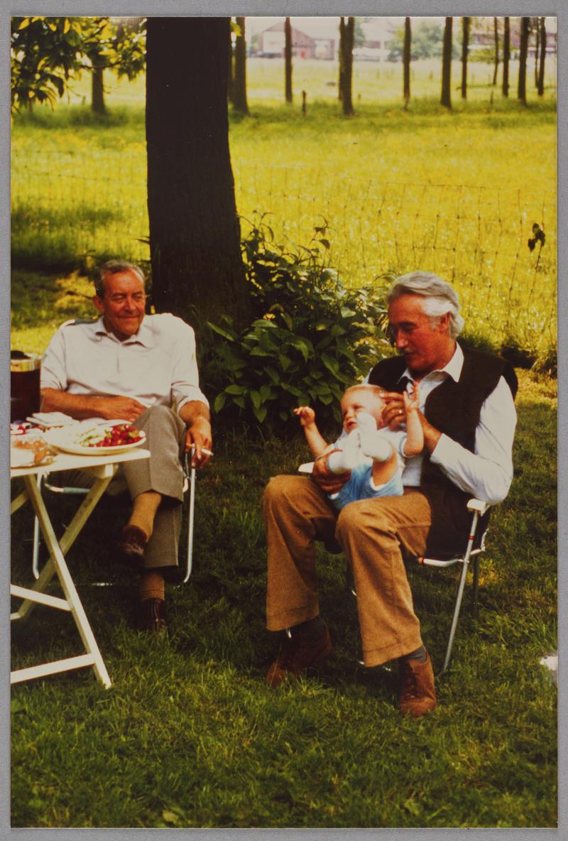 Photograph of Joe Rees sat at table, with unknown person. Louenders Farm