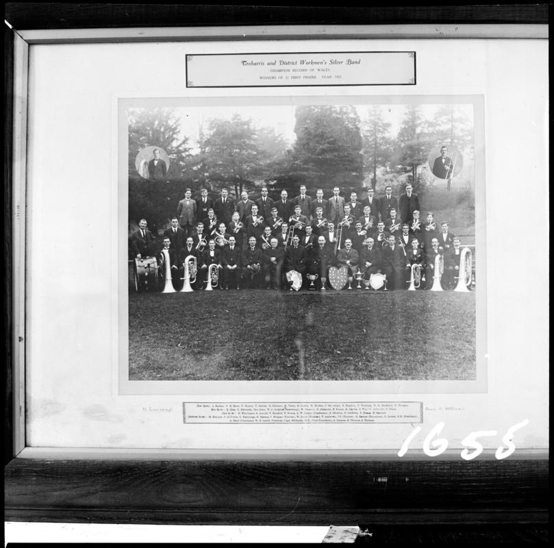 Black and white film negative of a framed photograph showing &#039;Treharris and District Workmen&#039;s Silver Band, winners of 22 first prizes.  Year 1922&#039;.  Appears to be identical to 2009.3/3055.