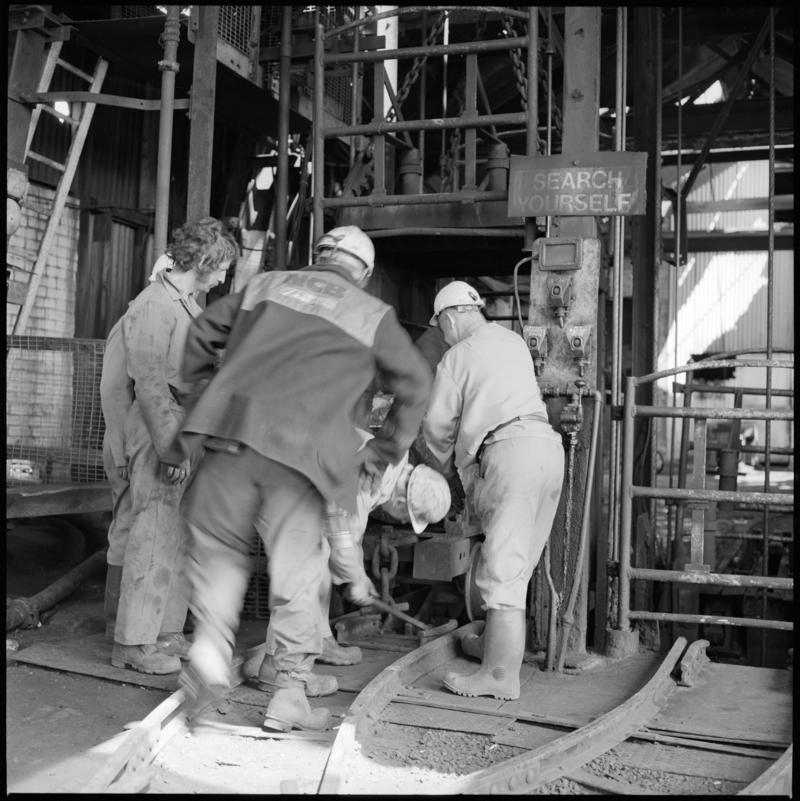 Black and white film negative showing men at pit top, Morlais Colliery 13 May 1981.  &#039;Morlais 13/5/81&#039; is transcribed from original negative bag.
