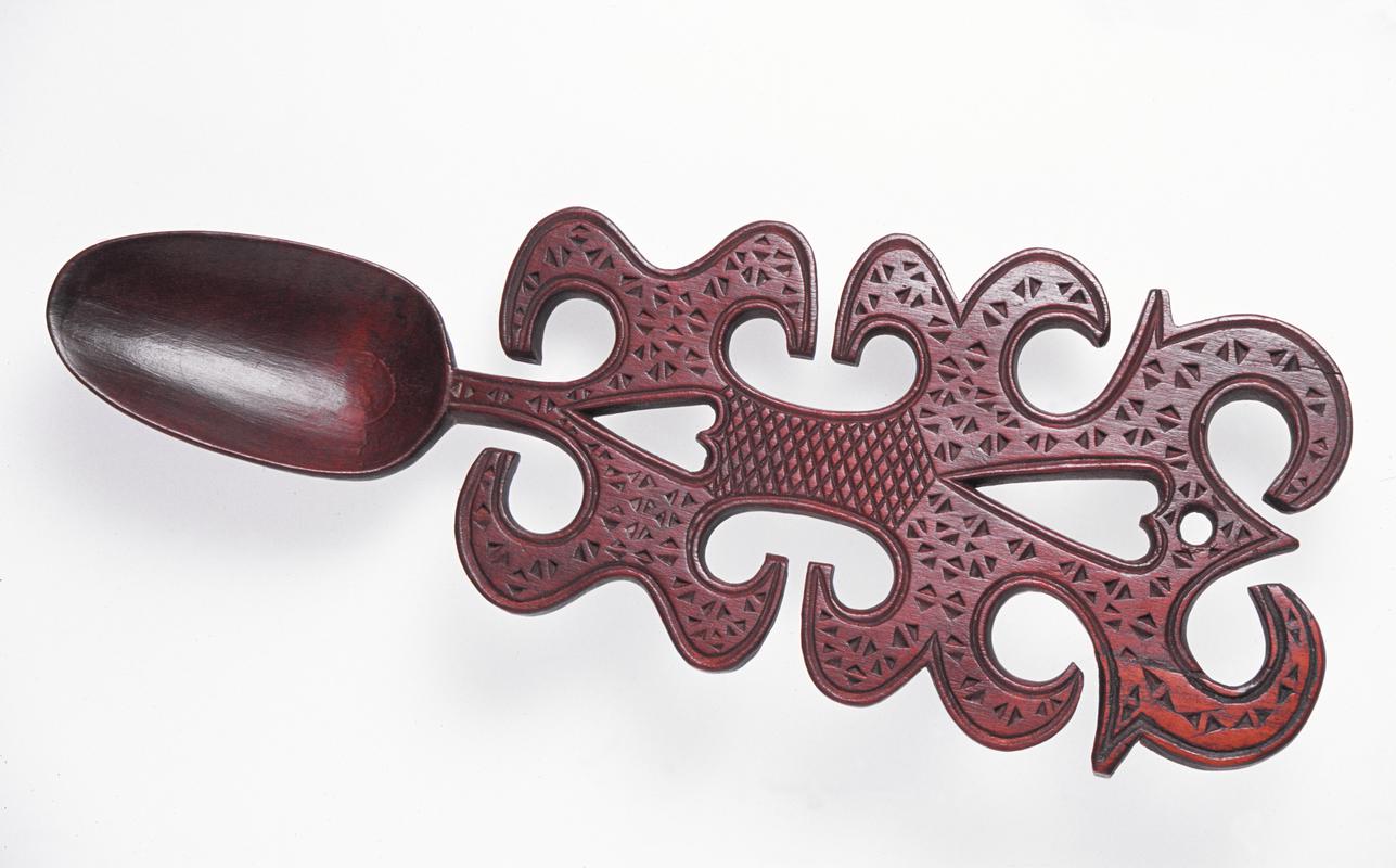 Lovespoon with panel handle, fretted heart devices and chip-carving.