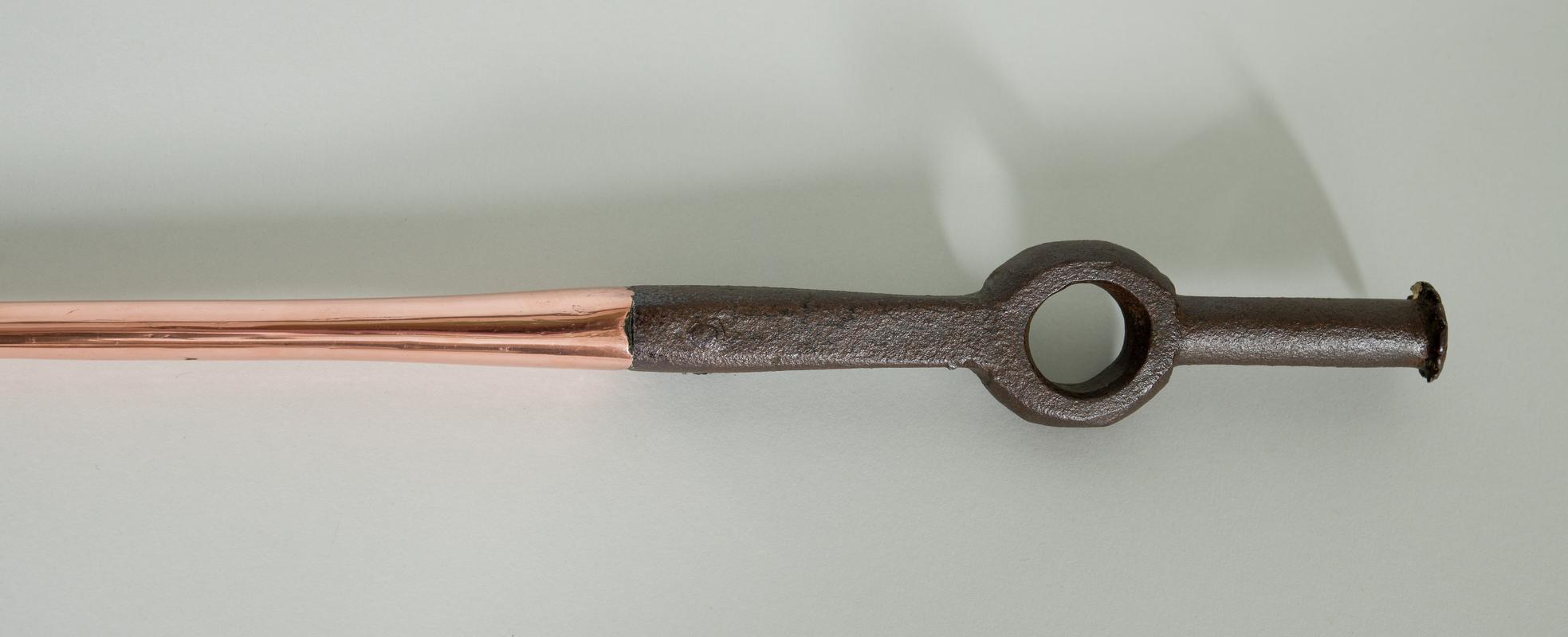 Copper pricker with metal handle.