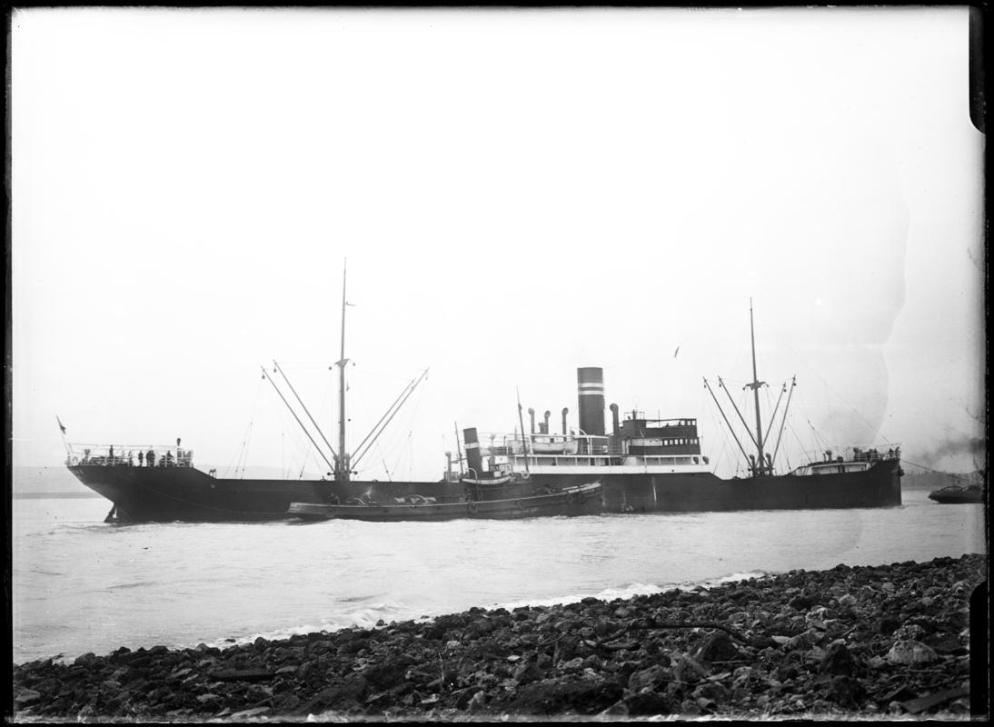 Starboard broadside view of S.S. EVERTONS and  tug at, c.1936.