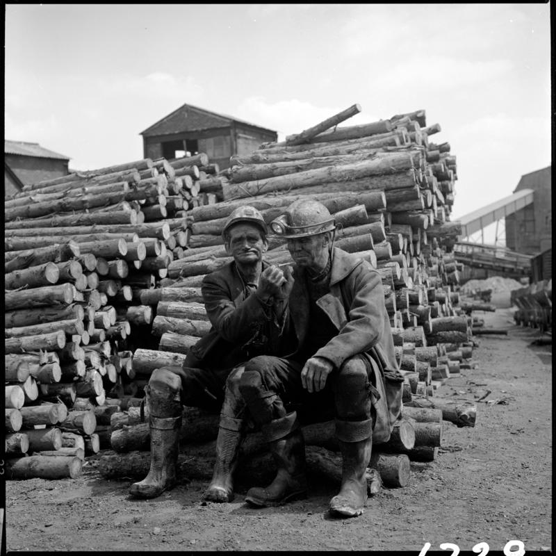 Peter &#039;Punchy&#039; Clarke (on left) and Wilf Jones, having a cigarette in the timber yard at the end of the morning shift, Big Pit 1978.