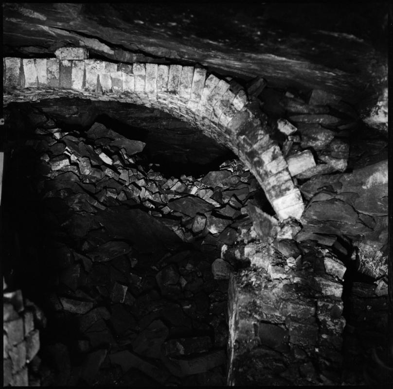 Black and white film negative showing the remains of the ventilation furnace at Tymawr Colliery.  The furnace was situated on the No. 3 landing in the Hetty shaft.  &#039;Hetty furnace&#039; is transcribed from original negative bag.