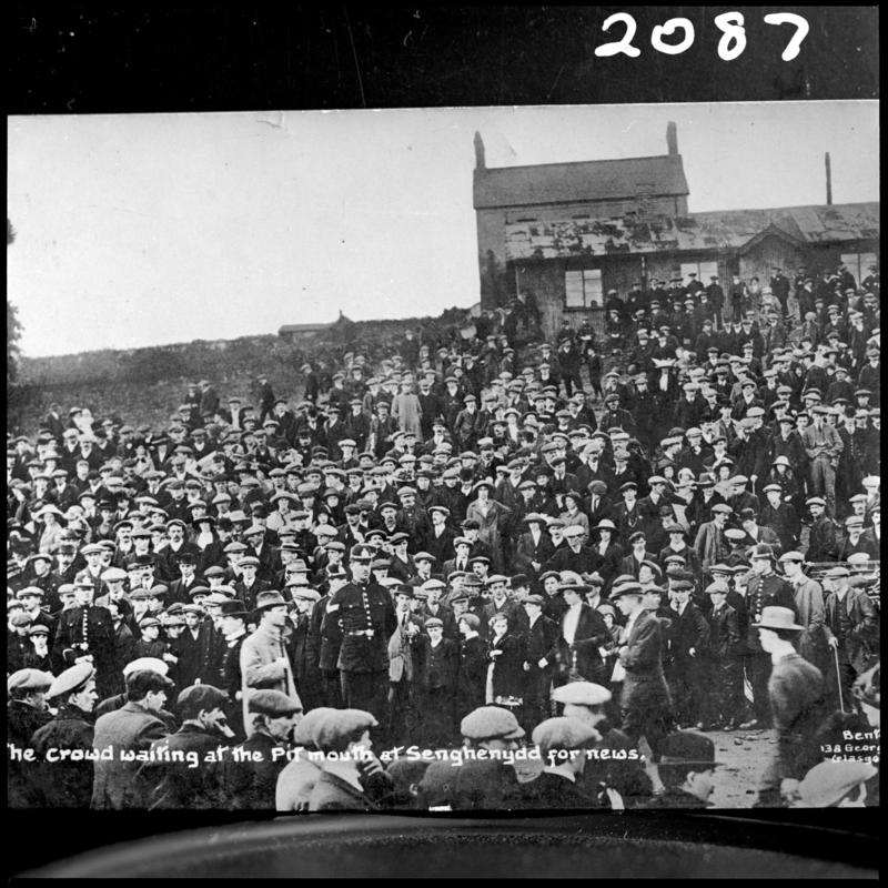 Black and white film negative of a photograph showing the scene at Universal Colliery, Senghenydd after the explosion of 14 October 1913.  Caption on photograph reads &#039;the crowd waiting at the pit mouth at Senghenydd for news&#039;.