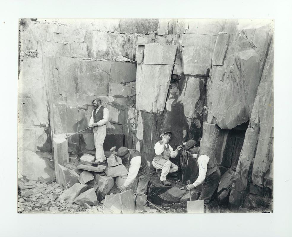 Quarrymen working on the rock face