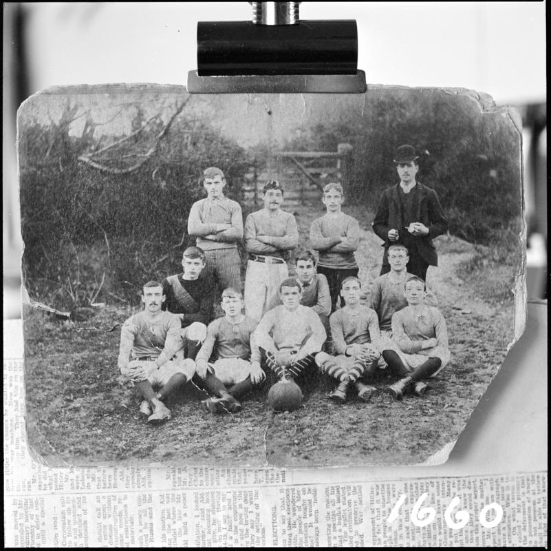 Black and white film negative showing a photograph of a sports team.