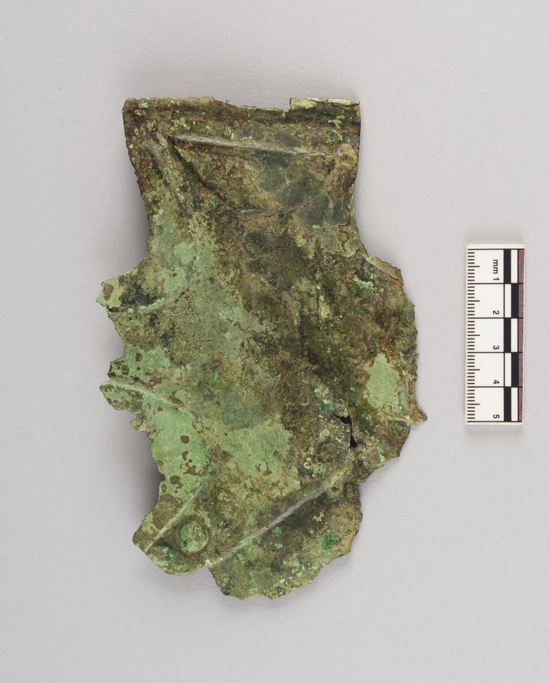 Roman copper alloy cheekpiece from helmet