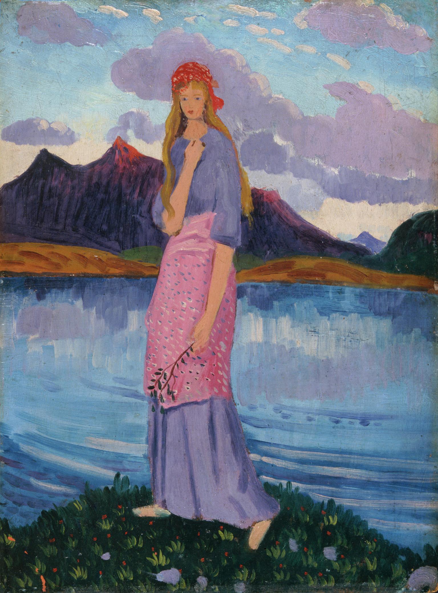 Girl standing by a lake