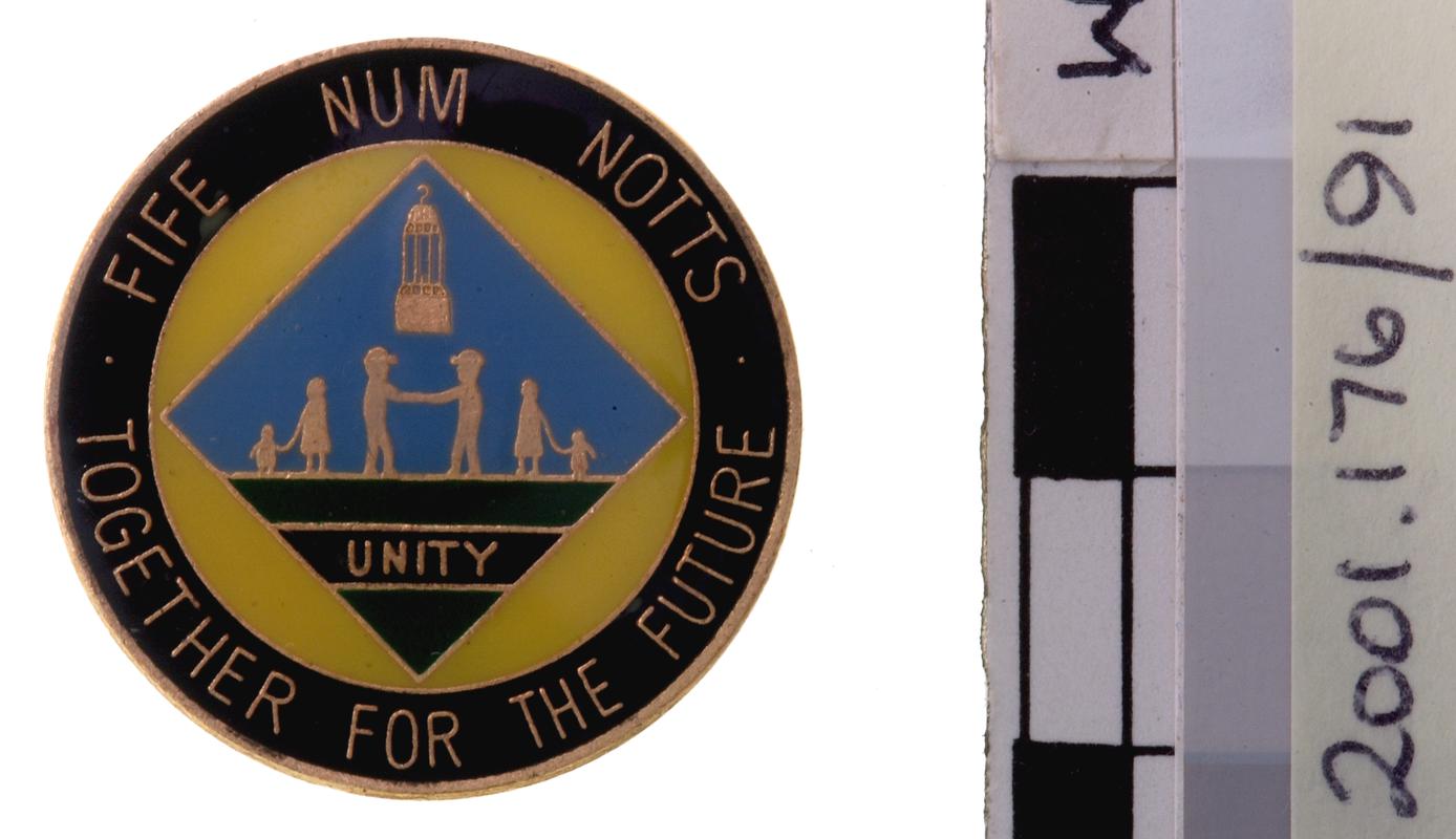 N.U.M. badge