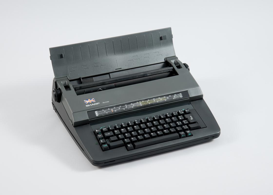 Sharp portable electronic typewriter (model PA-3100) made in Llay, Wrexham.