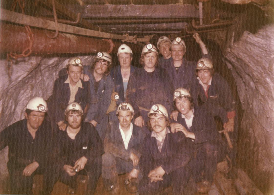 Group of students on a field trip at an unknown mine