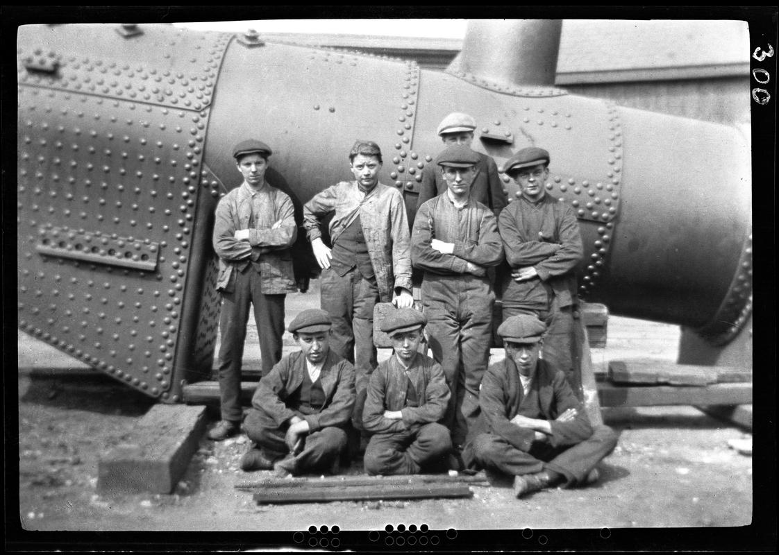 T.V.R. workmen in front of a locomotive boiler