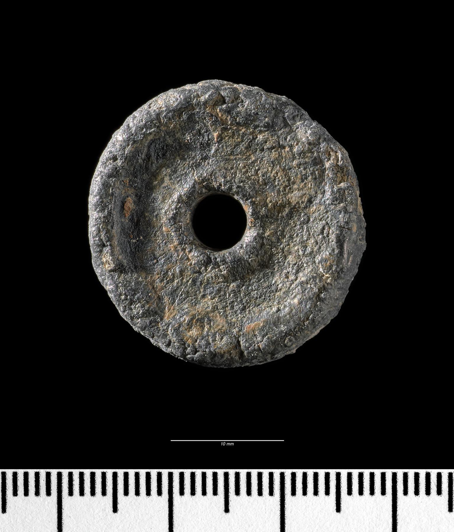 Early Medieval lead spindle whorl