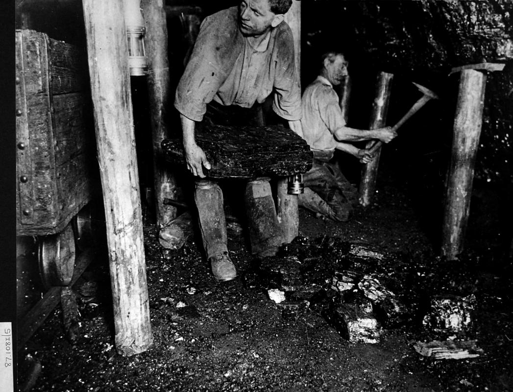 two miners at late 19th century coal face