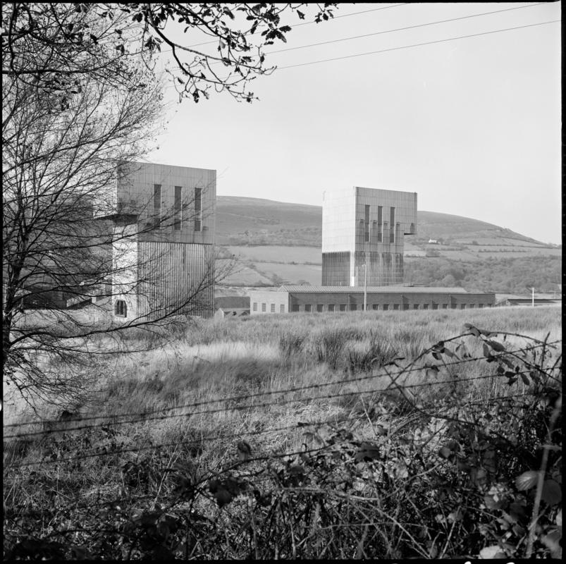 Black and white film negative showing a surface view of Abernant Colliery, 1980.  &#039;Abernant&#039; is transcribed from original negative bag.