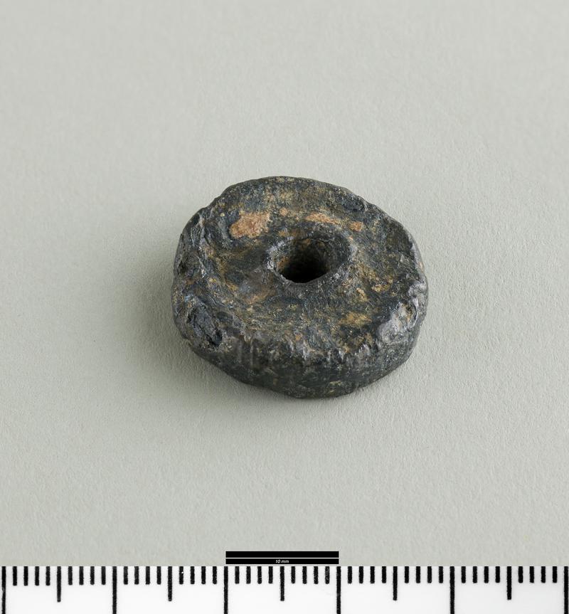 Early Medieval lead spindle whorl