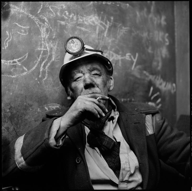 Black and white film negative showing a miner on break, Coegnant Colliery 25 November 1981.  &#039;25 Nov 1981&#039; is transcribed from original negative bag.