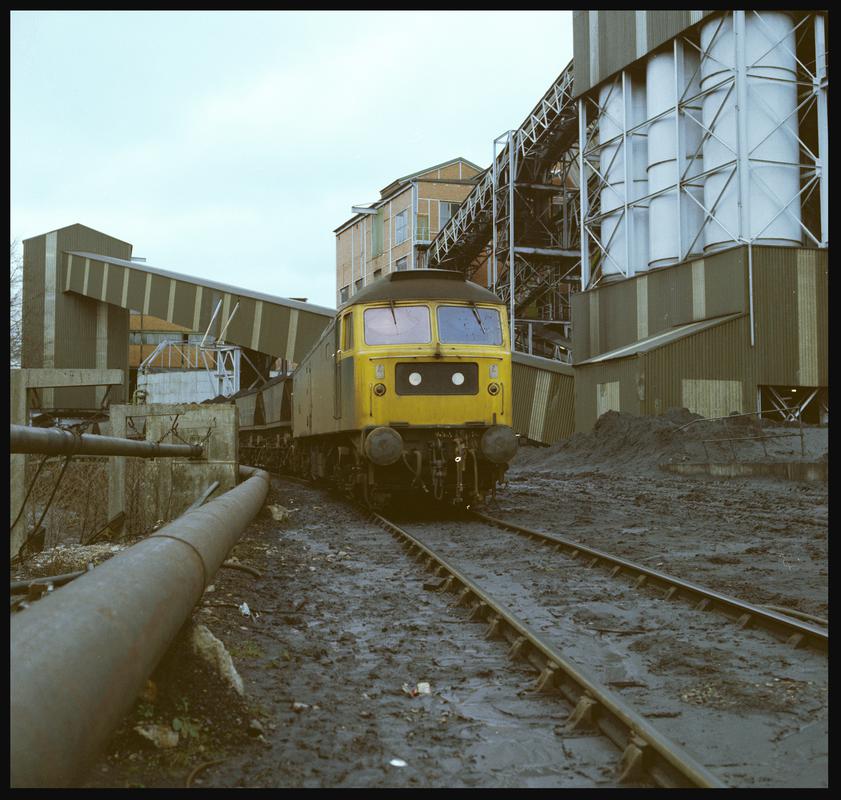 Colour film negative showing a locomotive on the south side of the washery, Taff Merthyr Colliery 1979.