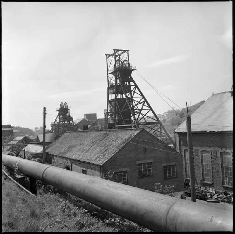Black and white film negative showing a view of the upcast and downcast shafts, Bargoed Colliery 20 May 1977.  &#039;Bargoed 20 May 1977&#039; is transcribed from original negative bag.