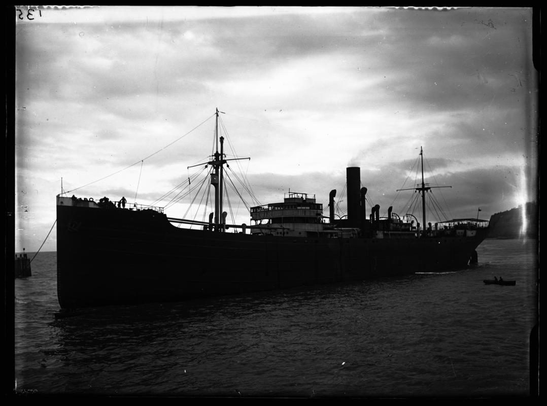 Port broadside view of S.S. SYLVIA DE LARRINAGA and watermans boat entering Cardiff Docks, c.1936.