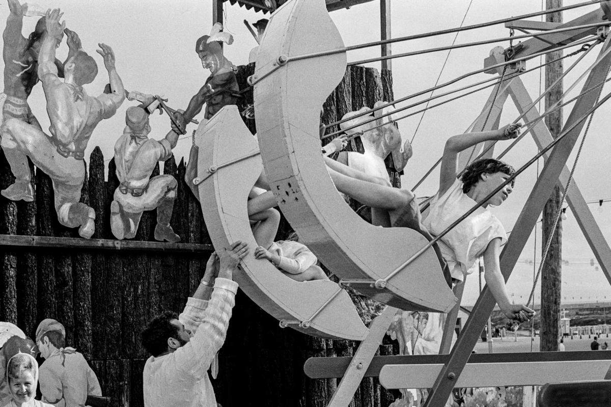 GB. WALES. Swings at Barry Island fun-fair. 1971