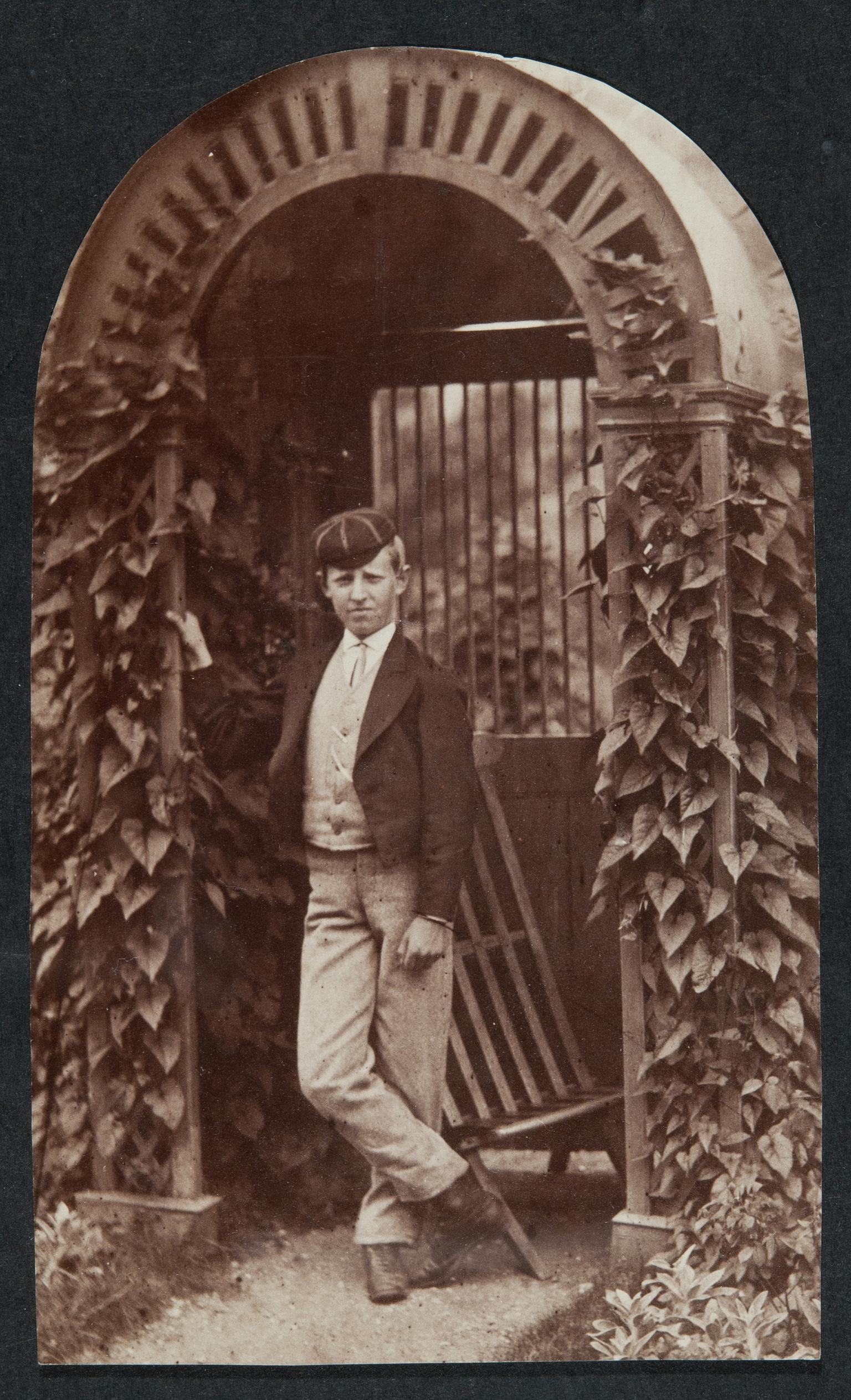 Boy in archway, photograph