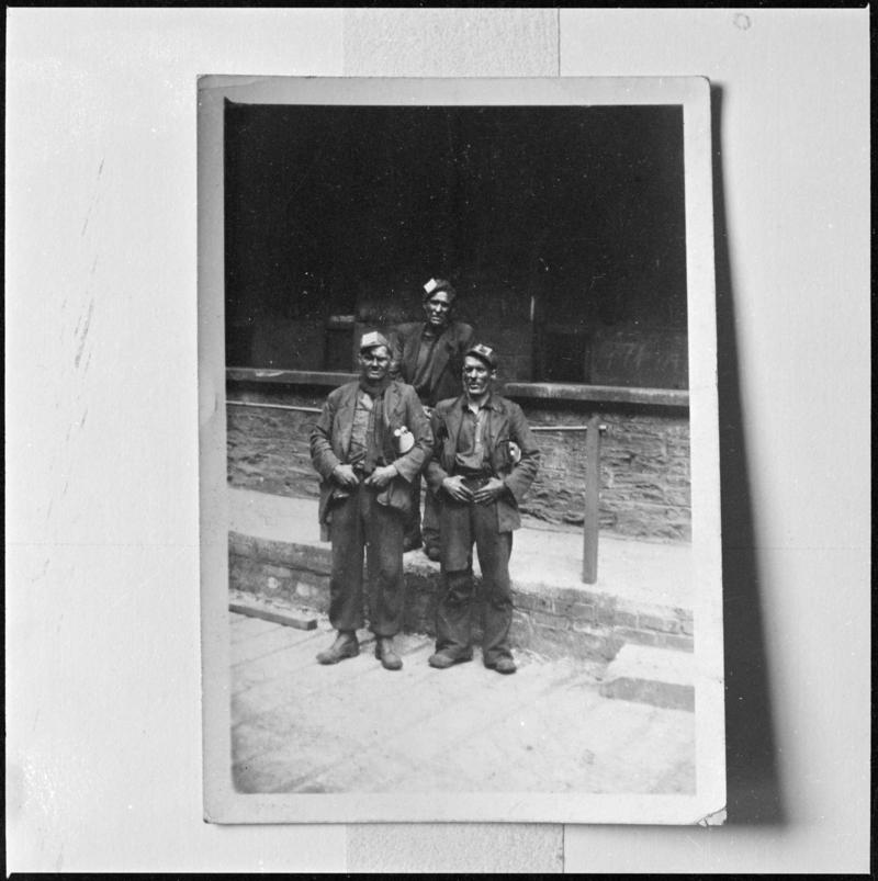 Black and white film negative of a photograph showing three miners, Deep Navigation Colliery.  &#039;Deep Navigation&#039; is transcribed from original negative bag.