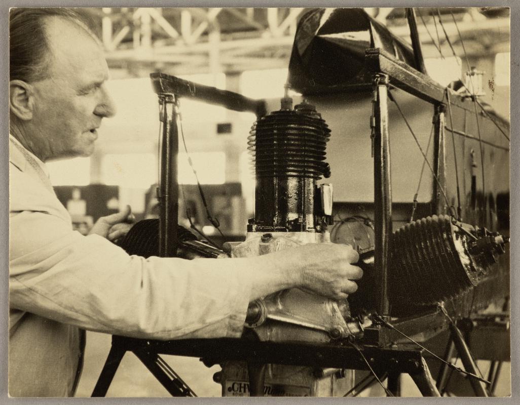 View of C.H. Watkins working on the Robin Goch engine.